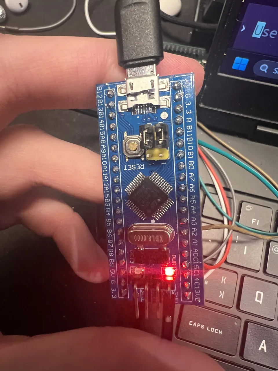Close-up of the Blue Pill development board used in the DiceGrid challenge.
